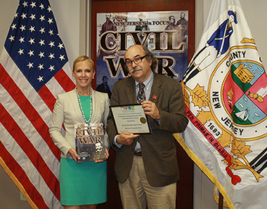 Monmouth County Clerk Christine Giordano Hanlon congratulates Gary Saretzky, Monmouth County Archivist, and the entire Monmouth County Archives division for being honored with the Kevin M. Hale Booklet Award by the League of Historical Societies of New Jersey for their booklet entitled “Civil War: New Jersey in Focus.”  